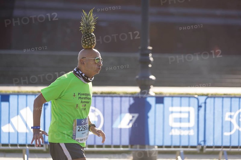 Pineapple Marathon Runner (Moshe Lederfein) balances a pineapple on his head during the run at the 50th BMW Berlin Marathon 2024 on 29 September 2024