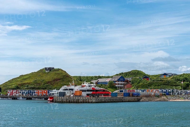 View from the Binnenreede to the inland harbour with the high-speed catamaran Halunder Jet, colourful lobster shacks, midland with the hospital, bomb funnel, offshore island of Heligoland, North Sea, Pinneberg district, Heligoland, Schleswig-Holstein, Germany, Europe
