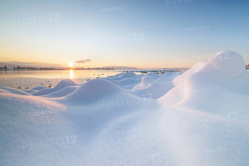 Winter snow cover with hills and a lake at sunrise, frosty atmosphere, Seegarten, Allensbach, Lake Constance, Baden-Württemberg, Germany, Europe