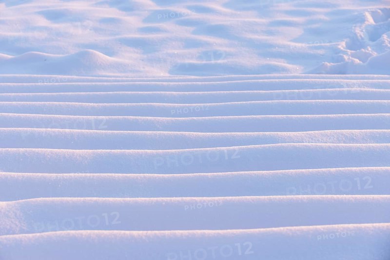 A close-up of snow with undulating steps reminiscent of sand dunes, Seegarten, Allensbach, Lake Constance, Baden-Württemberg, Germany, Europe