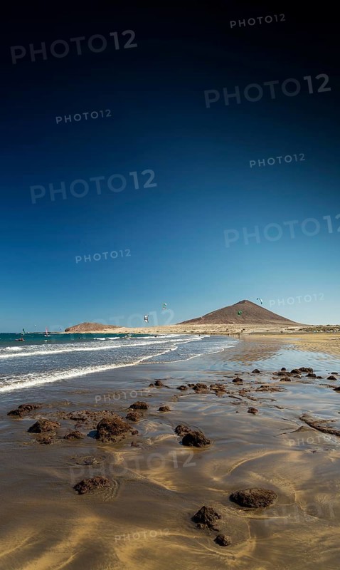 El medano tourist beach and montana roja famous landscape in tenerife spain