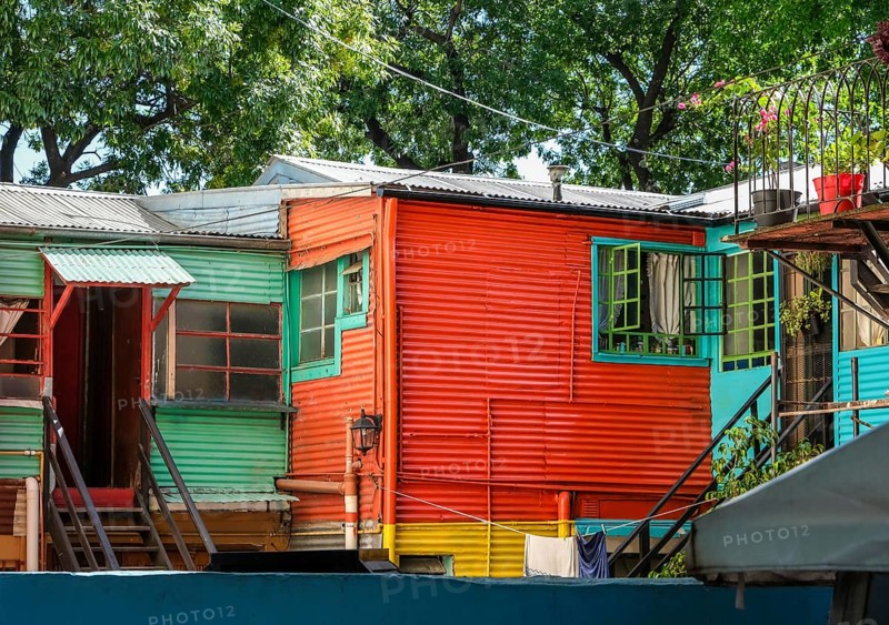 La Boca, Buenos Aires, Argentina, colourfully painted houses in the harbour district around the El Caminito alley. La Boca emerged at the end of the 19th century as a neighbourhood of Italian immigrants, most of whom worked as industrial workers. Today, the working-class neighbourhood is popular with tourists, partly because of its original houses, often built from the sheet metal of scrapped ships and brightly painted with ship paint. Many artists advertise their works on the pavements of El Caminito alleyway, South America