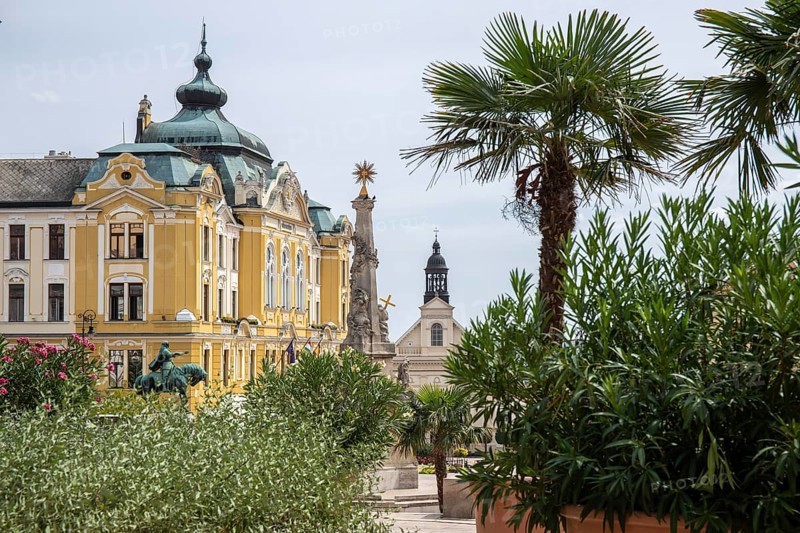 Historic city centre and central square with old historic buildings. Széchenyi Square in the centre of the five-church town shows the historical heritage of the city of Pécs, Dél-Dunántúl, Hungary, Europe