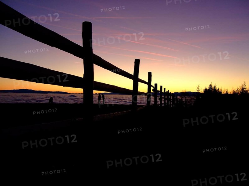 Fence in front of sunset
