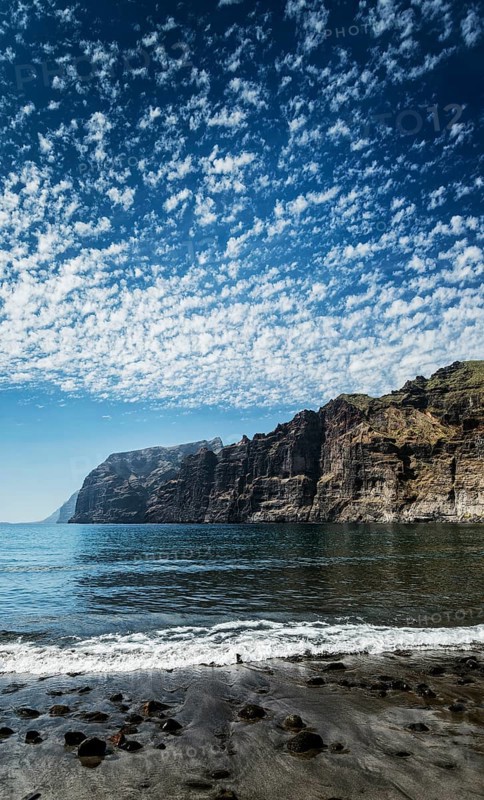Los gigantes cliffs natural famous landmark and volcanic black sand beach in south tenerife island spain