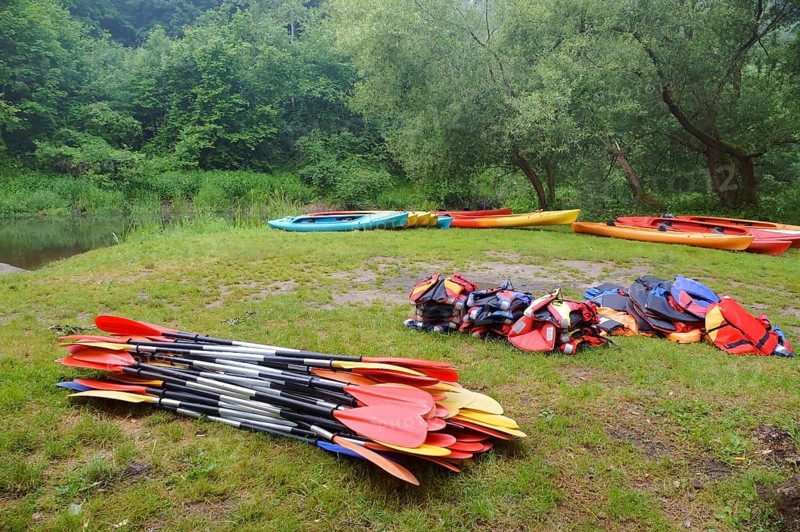 The oars from the canoes on the shore, preparing for the Canoeing