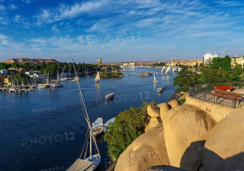 Beautiful landscape with felucca boats on Nile river in Aswan at sunset, Egypt, Africa