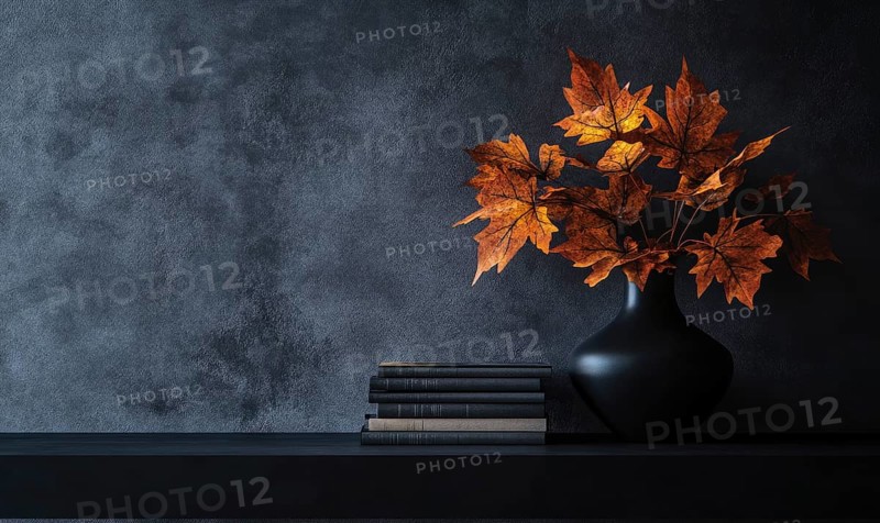 Sleek black table with a couple of books and a vase filled with autumn foliage AI generated