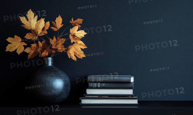 Sleek black table with a couple of books and a vase filled with autumn foliage AI generated