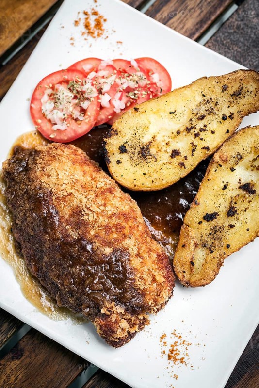 Chicken schnitzel with potato and gravy simple meal