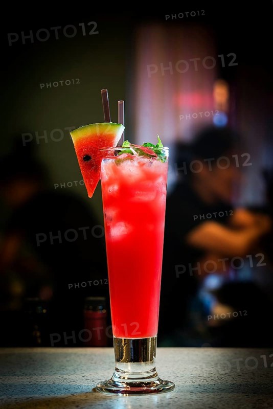 Fresh watermelon juice and vodka mixed cocktail drink at bar at night4