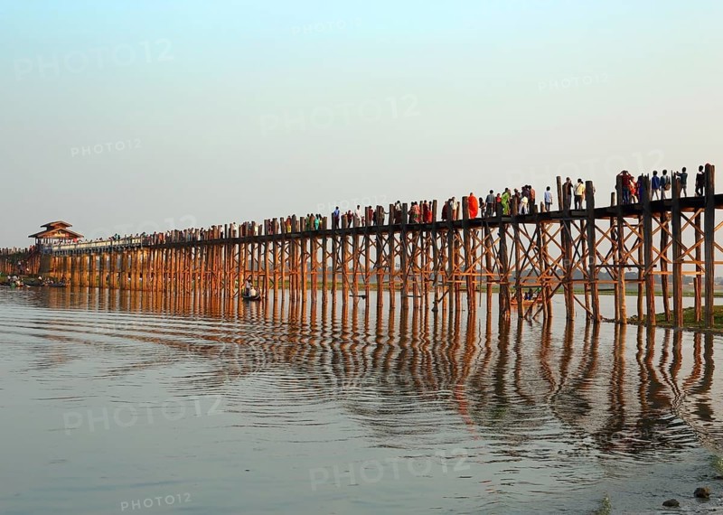 Famous U-Bein teak bridge at sunset on Taungthaman lake in Amarapura, Mandalay division, Myanmar, Asia