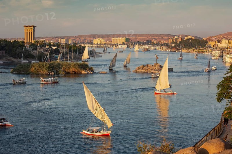 Beautiful panorama landscape with felucca boats on Nile river in Aswan at sunset, Egypt, Africa