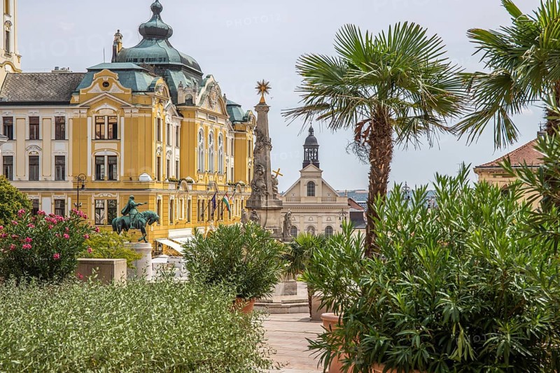 Historic city centre and central square with old historic buildings. Széchenyi Square in the centre of the five-church town shows the historical heritage of the city of Pécs, Dél-Dunántúl, Hungary, Europe