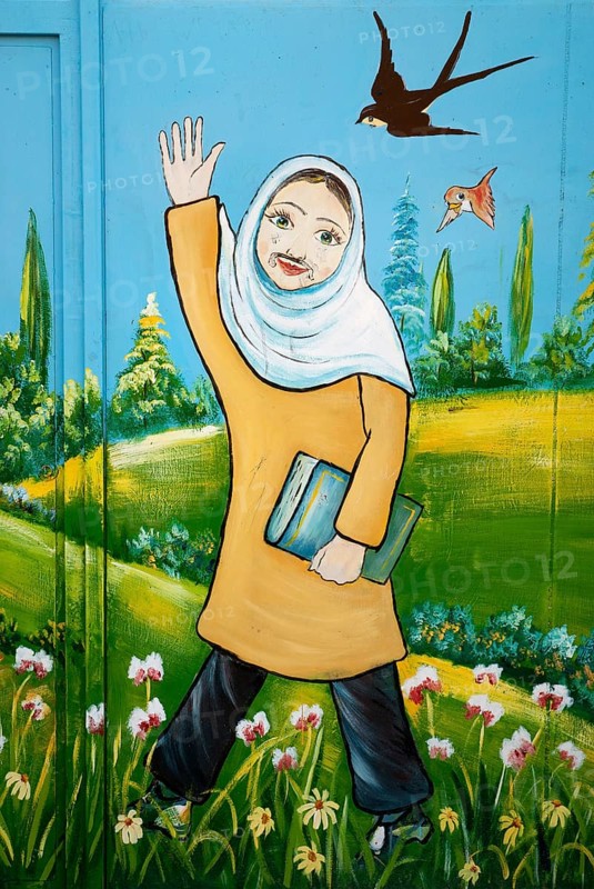 Mural of iranian muslim veiled schoolgirl in yazd iran