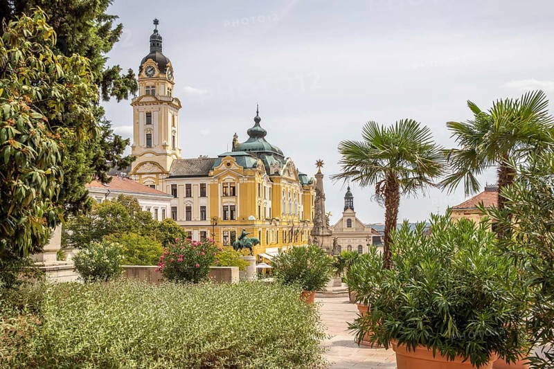 Historic city centre and central square with old historic buildings. Széchenyi Square in the centre of the five-church town shows the historical heritage of the city of Pécs, Dél-Dunántúl, Hungary, Europe