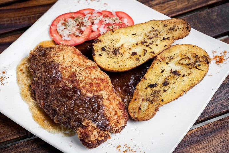 Chicken schnitzel with potato and gravy simple meal