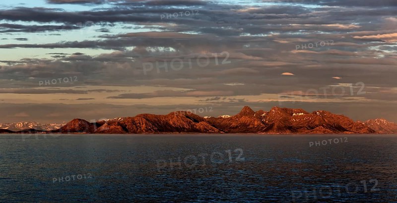 Panoramic view of the mountains on the Norwegian Sea coast at sunrise