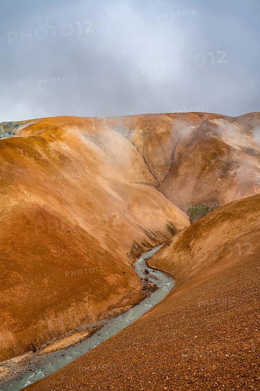 Steaming stream between colourful rhyolite mountains, Hveradalir geothermal area, Kerlingarfjöll, Icelandic highlands, Iceland, Europe