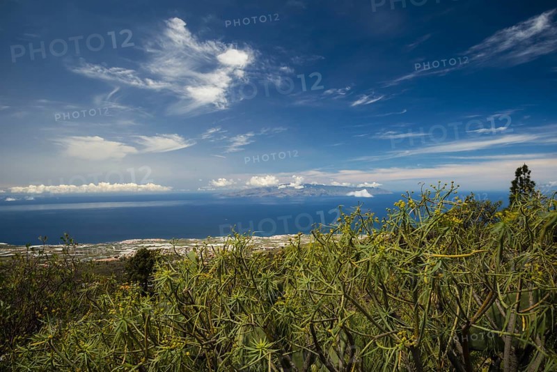 Panorama from Mirador de Chirche over Guia de Isora and Playa de San Juan to the west coast, with the island of Gomera in the background, Tenerife, Canary Islands, Spain, Europe
