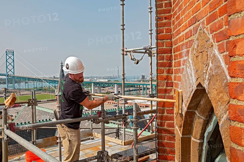 Detroit, Michigan, Kevin Driscoll cleans the bell towers of the Basilica of Ste. Anne de Detroit. Ste. Anne was founded by French explorers in 1701. This building was constructed in 1886 and now serves a largely Latino population