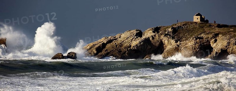 Waves crashing on rocky shore during storm at sea in winter, Côte Sauvage, Quiberon, Brittany, France, Europe