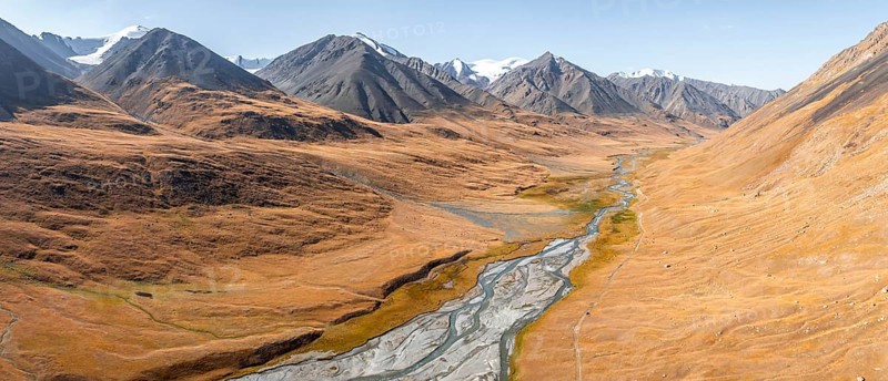 Aerial view, Burkhan mountain valley with meandering river, barren dramatic mountain landscape, Terskey Ala-Too, Tien Shan, Issyk Kul province, Kyrgyzstan, Asia