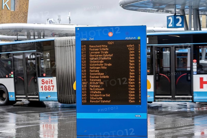 Digital timetable, display board, at the central bus station, WSW buses, at the main railway station, Wuppertal, North Rhine-Westphalia, Germany, Europe