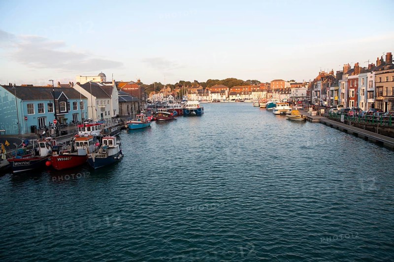 Colourful fishing boats in the harbour at Weymouth, Dorset, England, UK