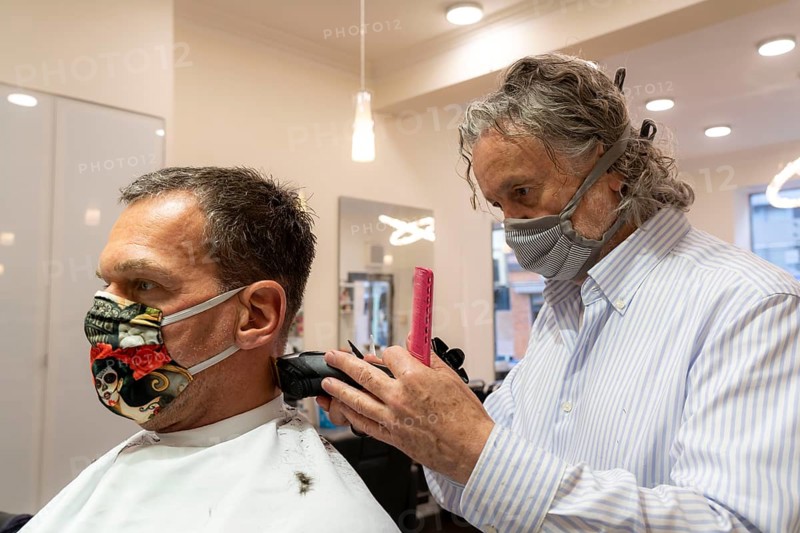 Hairdressing salon in Essen-Rüttenscheid, first customer after 6 weeks, shop closed due to Corona, hairdresser and customer with mouth-nose protection, breathing mask, distance regulation, Essen, North Rhine-Westphalia, Germany, Europe