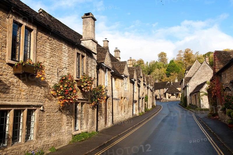 A row of attractive stone cottages in Castle Combe, Wiltshire, England, UK claimed to be England's prettiest village