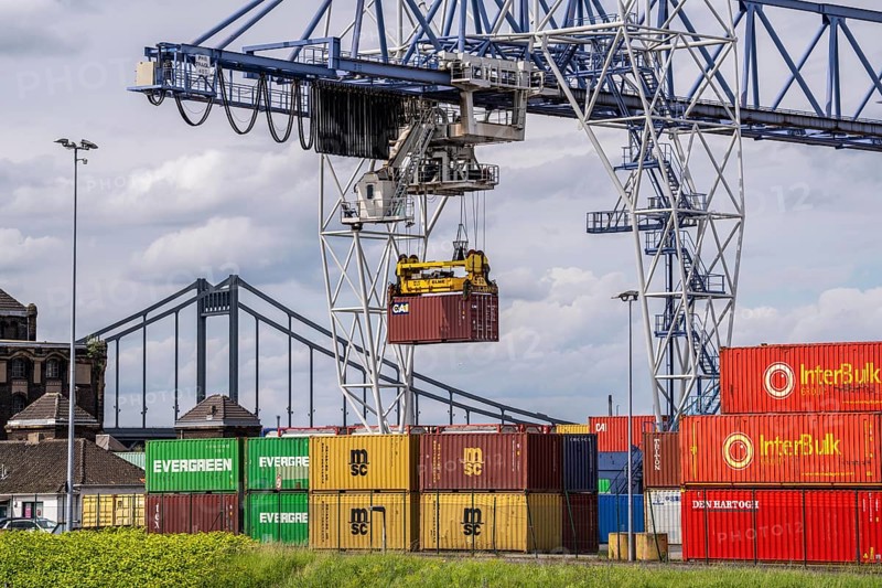 Container terminal at the Rhine port of Krefeld, inland port, 4th largest public port in North Rhine-Westphalia, trimodal handling of goods, goods, containers, general cargo, in the background the Krefeld-Uerdingen bridge over the Rhine, North Rhine-Westphalia, Germany, Europe