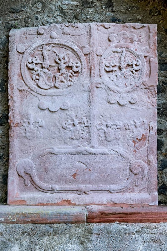 Medieval grave slab, tombstone of the Schelme zu Bergen, relief in red sandstone, castle garden, Ostzwinger, castle park, Friedberg Castle in the castle, old town, Friedberg, Wetterau, Hesse, Germany, Europe