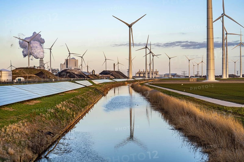 Solar park on the Slaperdijk dyke near the Eemshaven, test project, 17, 000 solar modules were installed over a good 5 kilometres, the Netherlands has over 22, 000 kilometres of dyke line, here it is being tested whether such an installation is successful and can be expanded, wind farm, behind the RWE coal-fired power plant Eemshavencentrale Groningen, Netherlands