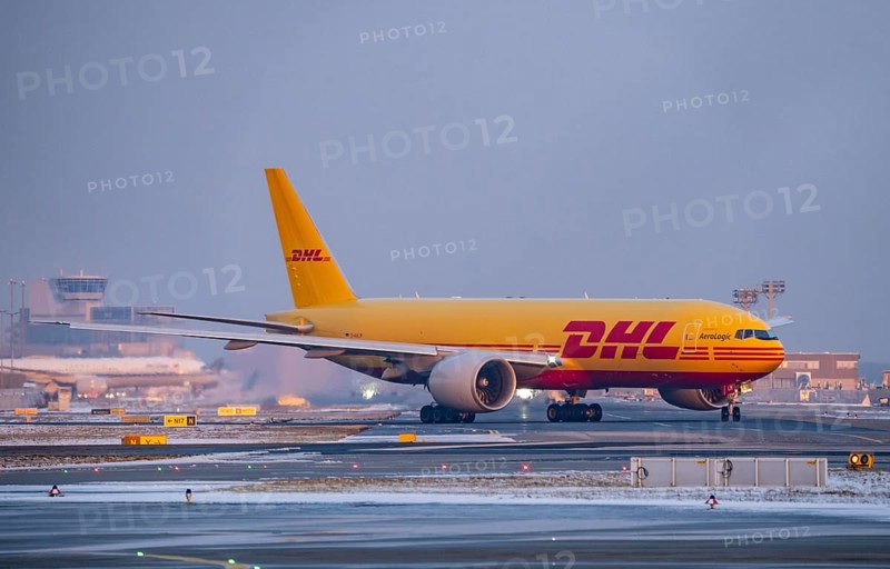 DHL, AeroLogic, Boeing 777F, on the taxiway to Runway West, Frankfurt FRA Airport, Fraport, in winter, Hesse, Germany, Europe