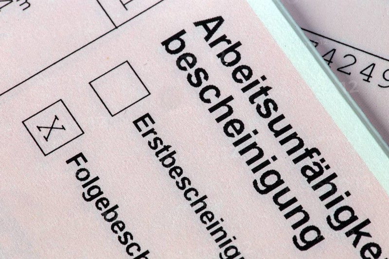 Symbolic image: Close-up of a certificate of incapacity for work