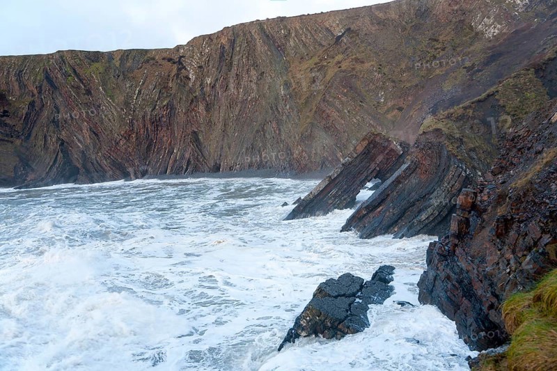 Complex folding of sedimentary rock strata in coastal cliffs at Hartland Quay, north Devon, England, United Kingdom, Europe