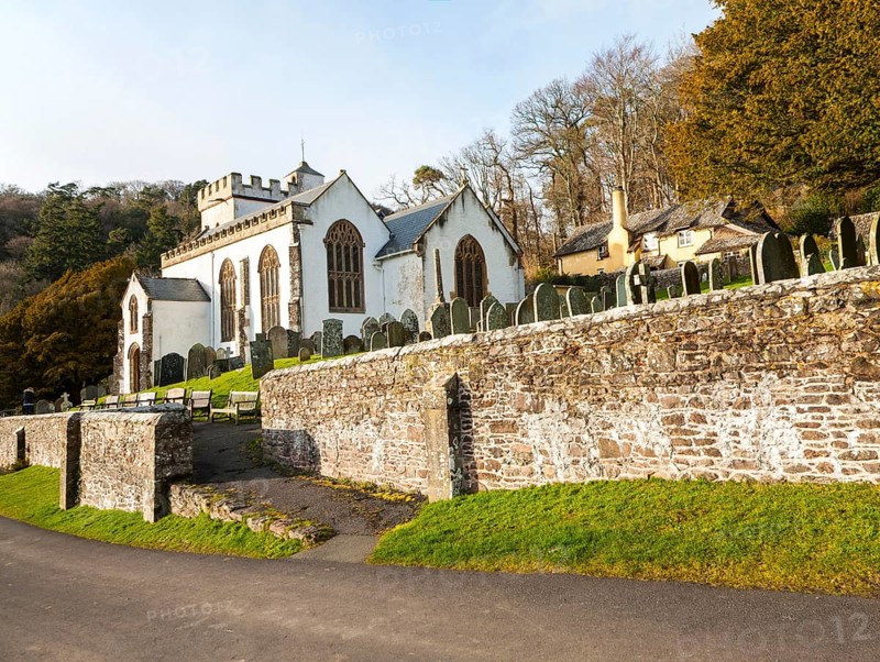 The Church of All Saints Selworthy, Somerset, England a whitewashed 15th-century building with a 14th-century tower