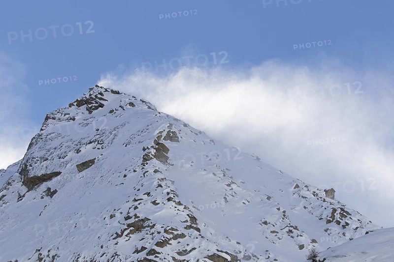 Snow covered mountain top, pinnacle Cima dell'Arolley in winter in the Gran Paradiso Massif of the Graian Alps, Aosta Valley, Italy, Europe