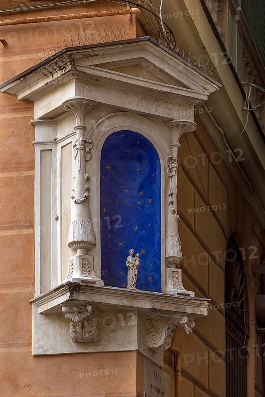 Niche on a corner house with a small statue of a saint, Genoa, Italy, Europe