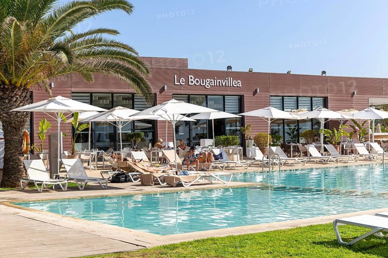 Tourists at swimming pool, Radisson Blu Resort, Taghazout Bay Surf Village, Taghazout, Morocco, North Africa, Africa