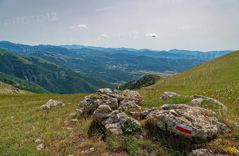 Mountain landscape on the edge of the Pian Grande di Castelluccio di Norcia plateau in the Monti Sibillini National Park in the Umbrian-Marche Apennines. Castelluccio di Norcia, Umbria, Italy, Southern Europe, Europe