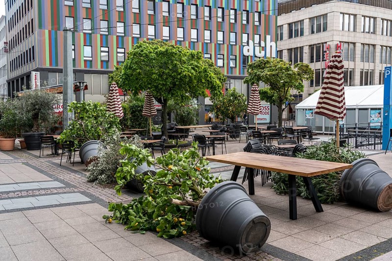 Stacked chairs and tables from various catering establishments, on Kennedyplatz, closed cafes, pubs, restaurants, effects of the lockdown in the corona crisis in Essen, North Rhine-Westphalia, Germany, Europe
