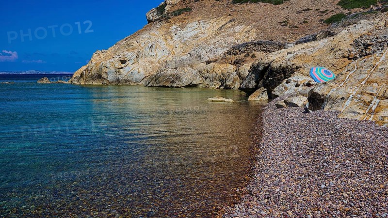Coastal landscape with blue sea, rocky beach, imposing rock formations under a clear sky, Lambi beach, pebble beach, Patmos, Dodecanese, Greek Islands, Greece, Europe