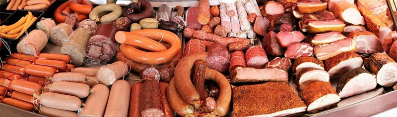 Panoramic picture of a sausage counter in a butcher's shop