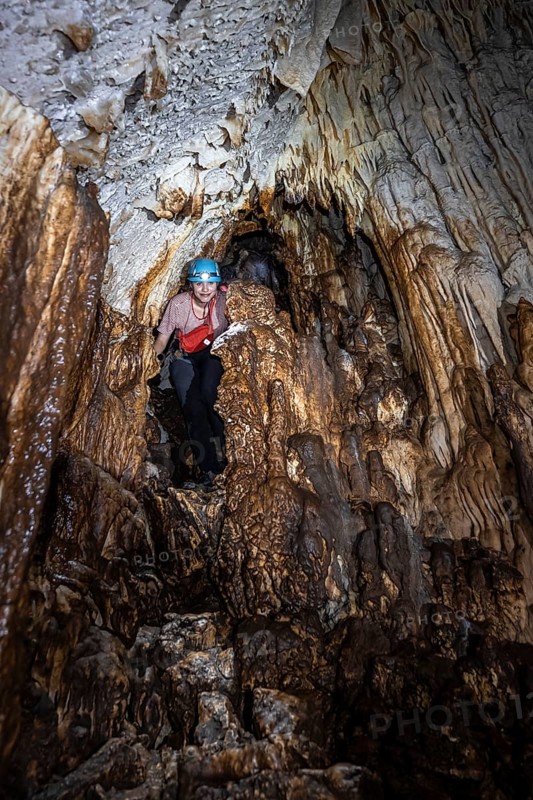 Woman exploring stalactite cave, Terciopelo Cave, Barra Honda National Park, Costa Rica, Central America