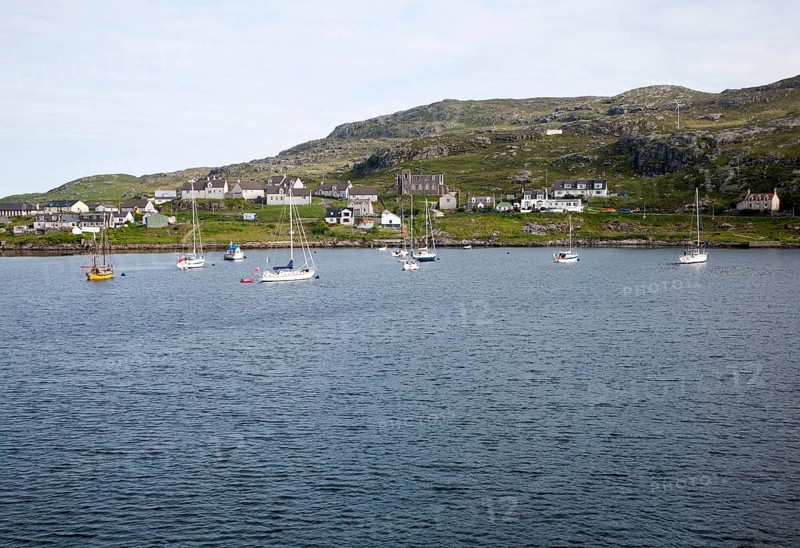 Yachts moored in the harbour at Castlebay, Barra, Outer Hebrides, Scotland, UK