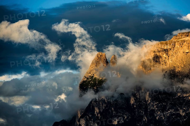 Sunset and mountain peaks in the clouds, Catinaccio, Dolomites, South Tyrol, Trentino-Alto Adige, Italy, Europe