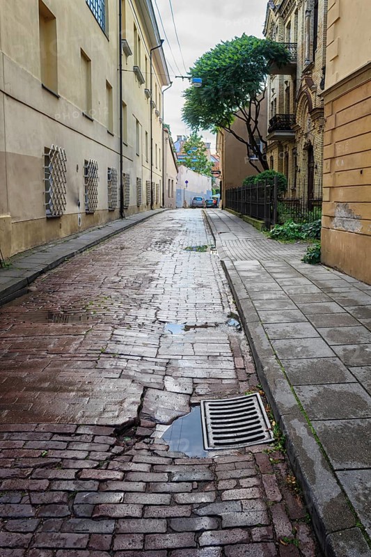 Old street of the historic center of Vilnius after rain