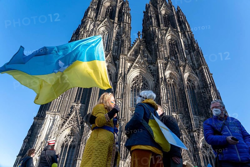 Peace demonstration against the war in Ukraine, instead of the Rose Monday parade in Cologne, with over 250, 000 participants, in front of Cologne Cathedral, with many carnivalists, North Rhine-Westphalia, Germany, Europe